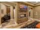 Cozy office space with a stone fireplace and built-in cabinets, perfect for remote work at 30556 N Sage Dr, Peoria, AZ 85383
