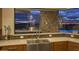 Gourmet kitchen featuring stainless steel appliances, a farmhouse sink, and an amazing outdoor view at 30556 N Sage Dr, Peoria, AZ 85383