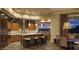A gourmet kitchen with wooden cabinets, stainless steel appliances, an island with seating, and a scenic view at 30556 N Sage Dr, Peoria, AZ 85383