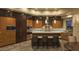 Modern kitchen with stainless steel appliances, breakfast bar, and custom cabinetry at 30556 N Sage Dr, Peoria, AZ 85383