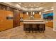 Modern kitchen with stainless steel appliances, pendant lighting, and a spacious island at 30556 N Sage Dr, Peoria, AZ 85383