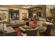Comfortable living room with modern decor, fireplace, and elegant dining area at 30556 N Sage Dr, Peoria, AZ 85383