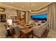 Inviting living room opens to a pool area, featuring cozy seating and modern design at 30556 N Sage Dr, Peoria, AZ 85383