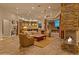 Spacious living area with open floor plan, stone fireplace, and natural light throughout at 30556 N Sage Dr, Peoria, AZ 85383