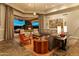 Comfortable living room with a ceiling fan, neutral décor, and an indoor-outdoor living feel at 30556 N Sage Dr, Peoria, AZ 85383