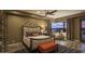 Comfortable bedroom with elegant decor, seating area, and sunset views at 30556 N Sage Dr, Peoria, AZ 85383