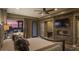 Serene main bedroom with fireplace, ensuite bathroom, and tranquil sunset views at 30556 N Sage Dr, Peoria, AZ 85383