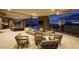 Relaxing outdoor living area with fireplace, comfortable seating, and views of the pool at 30556 N Sage Dr, Peoria, AZ 85383