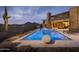 Stunning pool area featuring mountain views and desert landscaping at 30556 N Sage Dr, Peoria, AZ 85383
