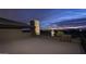 Spacious rooftop deck with stone accents provides an amazing view of the golf course and city lights at 30556 N Sage Dr, Peoria, AZ 85383