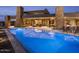 Sparkling swimming pool with lounge chairs overlooking the desert landscape and covered patio at 30556 N Sage Dr, Peoria, AZ 85383