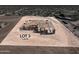 Aerial view of Lot 3, 1 Acre, under construction in a desert landscape at 33401 N 142Nd Way, Scottsdale, AZ 85262