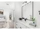 Bright bathroom with a large mirror, sleek vanity, and access to ensuite bedroom at 33401 N 142Nd Way, Scottsdale, AZ 85262