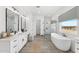 Luxurious bathroom with freestanding tub, walk-in shower, dual sinks, and modern fixtures at 33401 N 142Nd Way, Scottsdale, AZ 85262