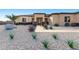 Stunning single-story home with xeriscaping, desert landscaping, and covered entryway at 33401 N 142Nd Way, Scottsdale, AZ 85262