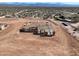Aerial view of a new home under construction, showcasing its framing and architectural design at 33401 N 142Nd Way, Scottsdale, AZ 85262