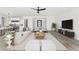 Spacious living room with modern furnishings and view to kitchen, perfect for entertaining at 33401 N 142Nd Way, Scottsdale, AZ 85262