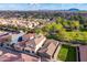 Aerial view of a residential neighborhood showcasing well-maintained homes, landscaping, and mountains at 3432 E Jasper Dr, Gilbert, AZ 85296