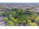 Aerial view of a park surrounded by a neighborhood, showcasing lush greenery and landscaping at 3432 E Jasper Dr, Gilbert, AZ 85296