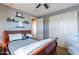 Bedroom featuring a ceiling fan, closet and a view into the en-suite bathroom at 3432 E Jasper Dr, Gilbert, AZ 85296