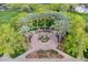 Community park featuring a central fountain, palm trees, benches, and meticulously designed landscaping at 3432 E Jasper Dr, Gilbert, AZ 85296