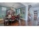 Elegant dining room featuring a chandelier, hardwood floors, and classic furnishings at 3432 E Jasper Dr, Gilbert, AZ 85296