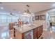 Open kitchen view featuring granite countertops, stainless steel appliances, and hardwood floors in a bright, modern space at 3432 E Jasper Dr, Gilbert, AZ 85296