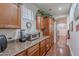 Kitchen counter with wooden cabinets, granite countertops, and stainless steel appliances at 3432 E Jasper Dr, Gilbert, AZ 85296