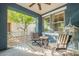 Cozy patio with two striped chairs and a table, perfect for relaxation and outdoor enjoyment at 3432 E Jasper Dr, Gilbert, AZ 85296