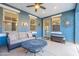 Covered patio area with comfortable seating, a ceiling fan, and an ornate metal table at 3432 E Jasper Dr, Gilbert, AZ 85296