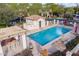Community pool with lounge chairs and clear blue water, surrounded by lush landscaping at 3432 E Jasper Dr, Gilbert, AZ 85296