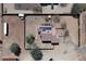 Aerial view of property with solar panels on the roof and a fully fenced yard in a desert landscape at 37509 N 7Th N St, Phoenix, AZ 85086
