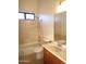 Bathroom with tub and shower combination, tiled floors and wood vanity at 37509 N 7Th N St, Phoenix, AZ 85086