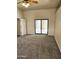 Carpeted bedroom featuring sliding glass doors and closet at 37509 N 7Th N St, Phoenix, AZ 85086
