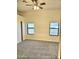 Bright bedroom featuring neutral walls, two windows, and a ceiling fan at 37509 N 7Th N St, Phoenix, AZ 85086