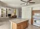 Open kitchen with island, white appliances, and view to the living room at 37509 N 7Th N St, Phoenix, AZ 85086