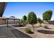 Beautifully landscaped backyard featuring a gazebo and desert-friendly foliage at 38 S 197Th Ln, Buckeye, AZ 85326