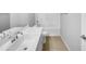 Well-lit bathroom featuring single vanity, tub, and tile floors at 41285 W Sussex Dr, Maricopa, AZ 85138