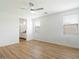 Light-filled bedroom has sleek ceiling fan and two sunny windows at 4336 N 93Rd Dr, Phoenix, AZ 85037