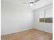 Bright bedroom featuring a ceiling fan and window with natural light at 4336 N 93Rd Dr, Phoenix, AZ 85037
