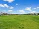Expansive green grassy field provides ample space for recreational activities within the community at 4336 N 93Rd Dr, Phoenix, AZ 85037