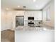Modern kitchen with stainless steel appliances, granite countertops, and white cabinets at 4336 N 93Rd Dr, Phoenix, AZ 85037