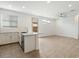 Contemporary kitchen with island and stainless-steel dishwasher at 4336 N 93Rd Dr, Phoenix, AZ 85037