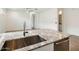 Kitchen island includes granite countertops, stainless steel sink and stainless steel appliances at 4336 N 93Rd Dr, Phoenix, AZ 85037