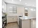 Bright kitchen features stainless steel appliances, granite counters, and white cabinets at 4336 N 93Rd Dr, Phoenix, AZ 85037