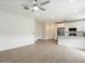 Spacious living area featuring tile flooring and an open layout to kitchen at 4336 N 93Rd Dr, Phoenix, AZ 85037
