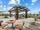 Outdoor picnic area featuring covered seating, tables, and barbecue grills perfect for community gatherings at 4336 N 93Rd Dr, Phoenix, AZ 85037