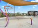 Community splash pad featuring shade canopy, playful water features and seating at 4336 N 93Rd Dr, Phoenix, AZ 85037