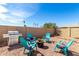 Inviting backyard area with modern grill, seating around fire pit and freshly graveled ground at 614 W Morrow Dr, Phoenix, AZ 85027
