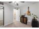 Cozy bedroom features ceiling fan, closet with mirrors, guitar, and ensuite bathroom at 614 W Morrow Dr, Phoenix, AZ 85027